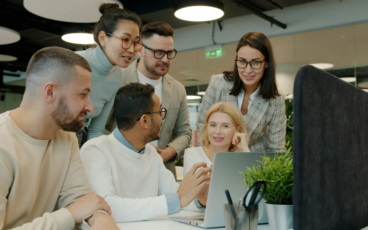 The team reviews the results together on a laptop at the office